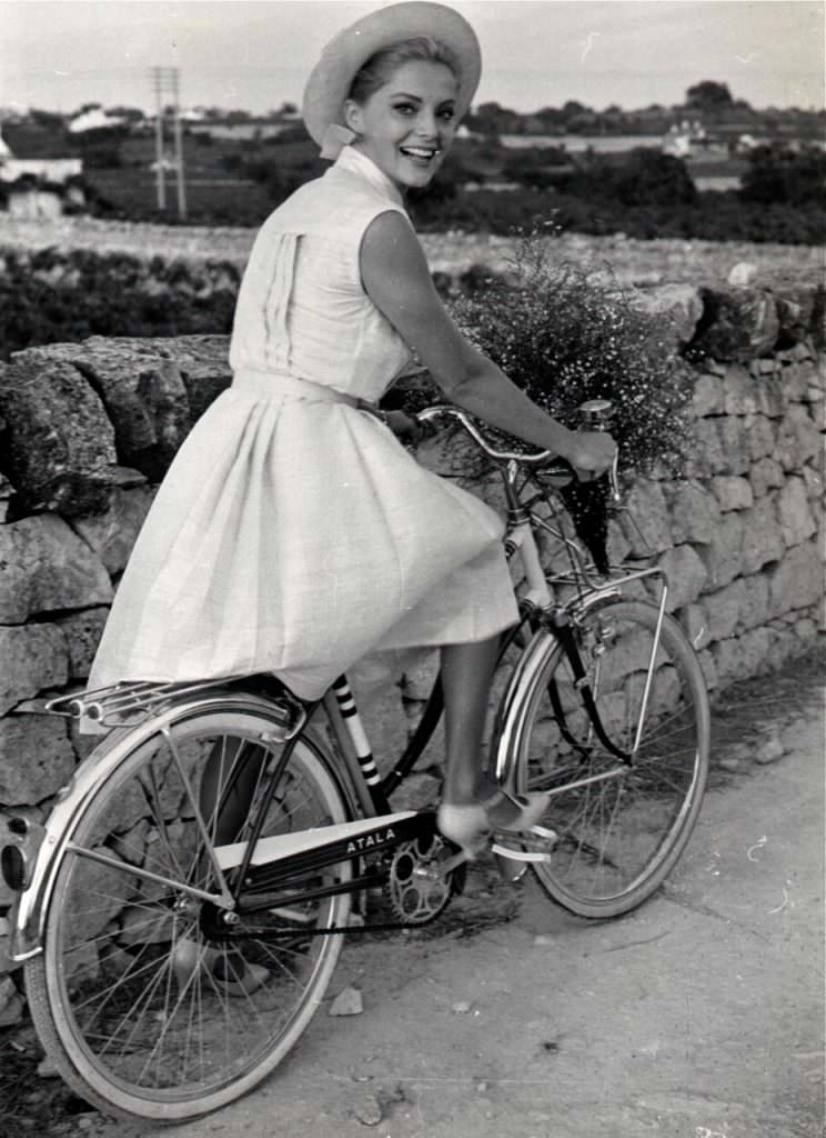 Virna Lisi Rides A Bike.